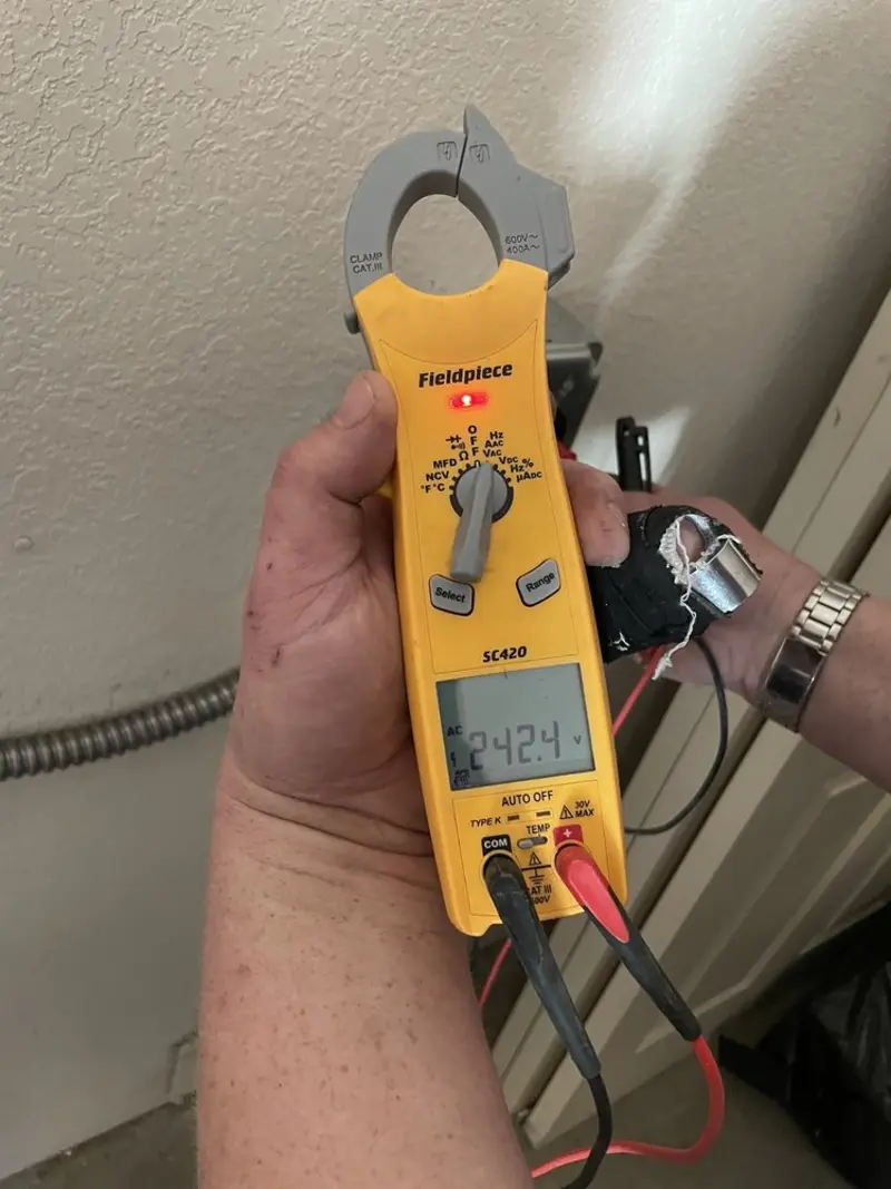 Voltage testing with clamp meter during Ceiling Fan Installation in Dell Rapids
